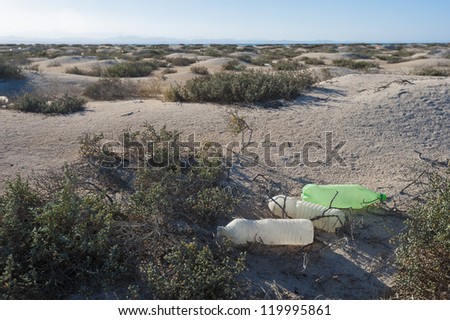 Old rubbish discarded on a remote desert island concept environmental issues