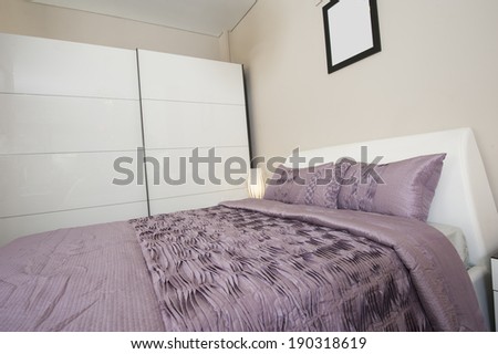 Bedroom area in show home with wardrobe and lamps