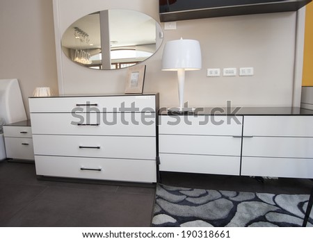 Dresser unit and drawers in bedroom area of furniture show home