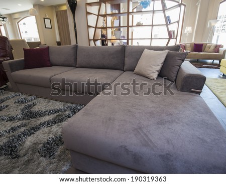 Large L-shaped corner sofa in living room furniture show home