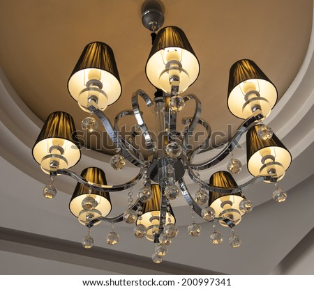 Ornate eight bulb ceiling light chandelier with decorative crystal balls