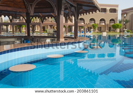 Swimming pool bar in luxury tropical hotel resort