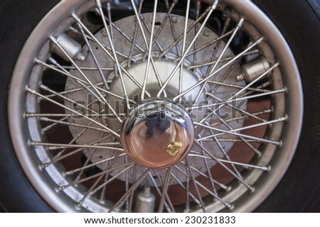 Closeup detail of an old car tyre wheel with spokes