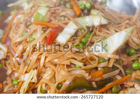 Closeup of vegetable chow mein chinese meal on display at a hotel buffet