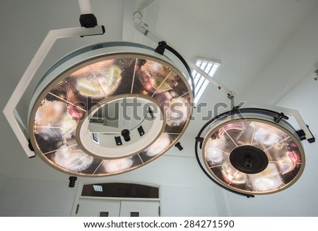 High powered circular surgery lights in a hospital operating room
