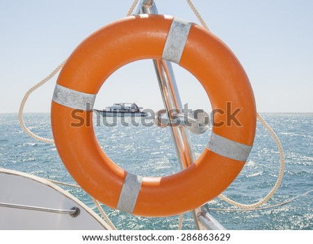 Life ring safety equipment on a boat in tropical sea