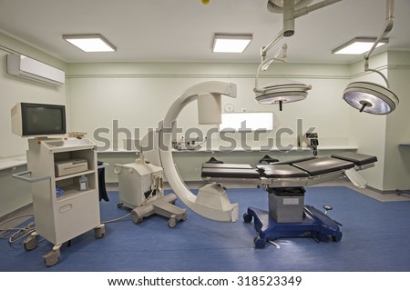 Operating room of a medical center with monitoring equipment and CT scanner
