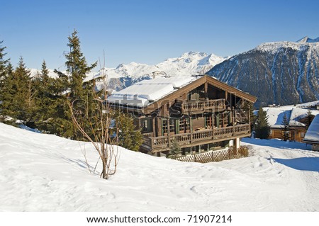 Mountain chalet in winter covered with snow