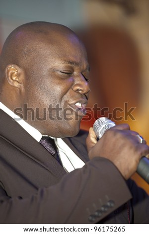 African male giving a live soul singing performance