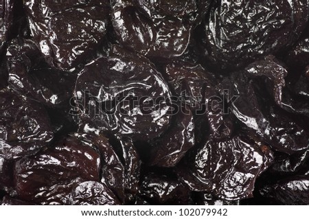 Heap of dried prunes close-up.