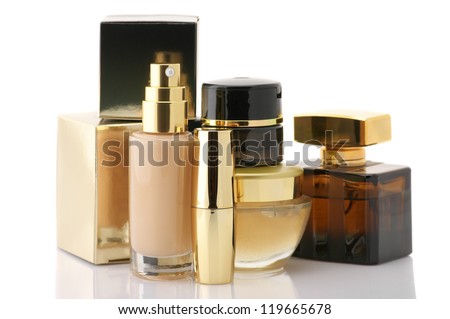 Set Of Gold Cosmetic Products Isolated On White Background.