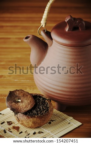 Pu-erh tea aged in tangerine and ceramic teapot.