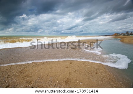 Sand bar and sea tide.