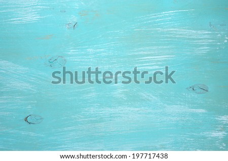 Turquoise painted wood background.
