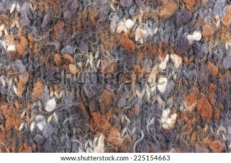 Fluffy knitted pattern from fancy yarn.
