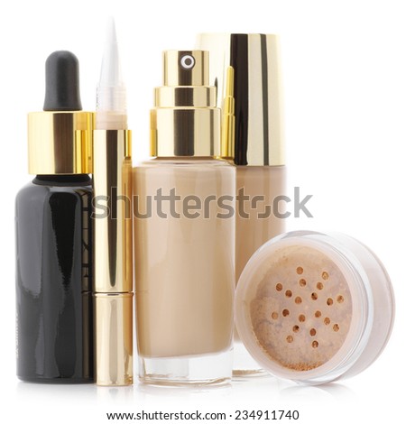 Two glass bottle of liquid foundation, corrective concealer, loose mineral powder and face serum isolated on white background.