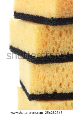 Stack of cleaning sponges close-up on white background.