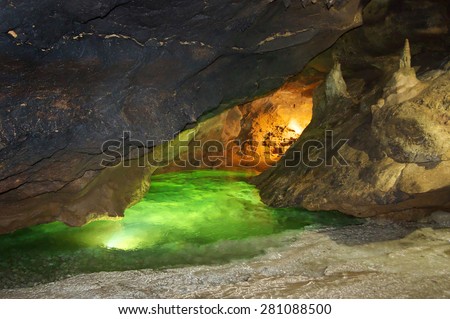Karst cave with underground river and speleothems. Kizil-Koba (Red cave), Crimea.