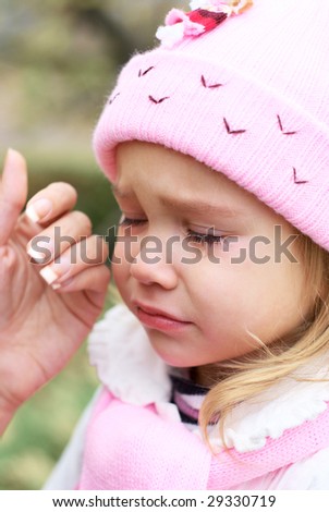 stock-photo-crying-little-girl-and-hand-wiping-tears-29330719.jpg