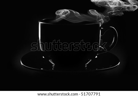 Black cup of coffee with steam on black background.