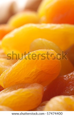 Heap of dried apricots close-up as background.