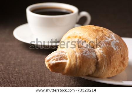 10.  Fatmagül'un sucu ne ? ~ General Discussions - Comentarii Stock-photo-croissant-and-white-cup-of-black-coffee-on-brown-canvas-73320214