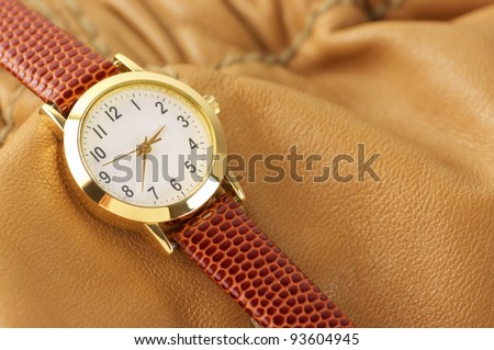 Classical wrist watch with leather accessory.