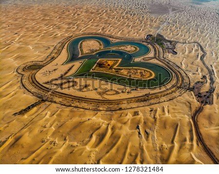 Aerial View of entire Love Lake Dubai at Al Qudra. A new tourist destination in the vicinity of Al Qudra Lakes Dubai. Love Lake is one of the major tourist attraction in Dubai.