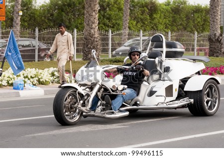 DUBAI - UAE - APRIL 06 2012: A biker with his  bike during the \