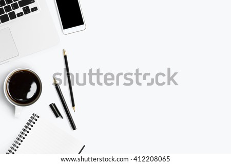Top view with copy space of white working table with laptop, smartphone, cup of coffee and other supplies.