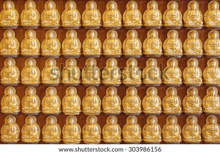 Buddha statues in lines at Chinese church in Thailand.
