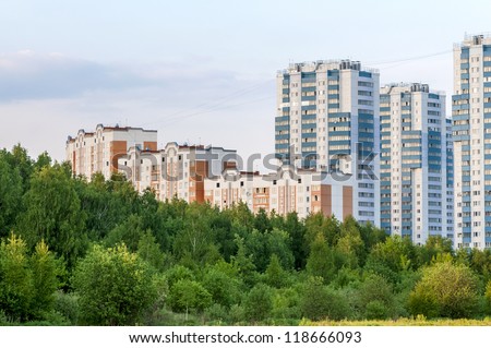 new apartment buildings in eco-friendly green belt (evening time)