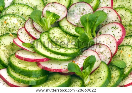 salad of fresh cucumbers and radishes with leaves Corn salad