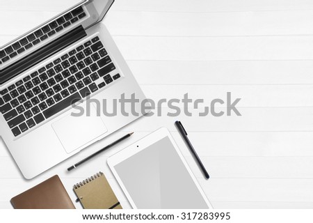 Top view Set of gadget, pen, laptop , spectacle on wood table background
