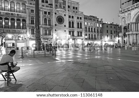 VENICE,ITALY-CIRCA JUNE 2012: Tourists enjoy the historical city of Venezia at night in Italy, famous UNESCO World Heritage Site, circa June 2012 in Venice, Italy