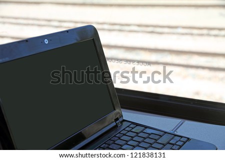 Working with the laptop,Train interior, Transilien wagon, Paris, France