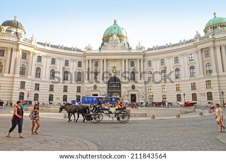 VIENNA AUSTRIA-CIRCA JULY 2014: Horse-drawn carriages at Hofburg Palace on July 2014 in  Vienna Austria