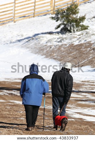 Couple out for a walk with their dog. Javalambre sky run.Teruel province.Aragon.Spain