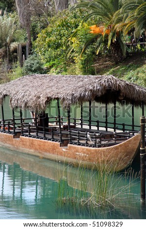 Boat and Tropical garden from Polynesia Theme park  Catalonia Tarragona Spain