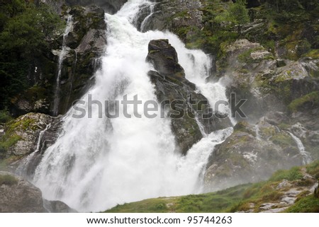 Waterfall springing from Briksdal glacier, Jostedalsbreen national park, Norway.
