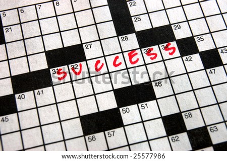 The word success written in a crossword puzzle in red ink