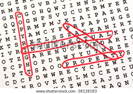 The Words Copyright, Intellectual, Property, & Patent on Word Search Puzzle Circled in Red Ink