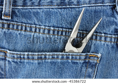 Close Up of Needle-Nosed Pliers in Blue Jeans Pocket