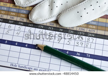 Close up of Golf Score Card with Glove and Green Pencil