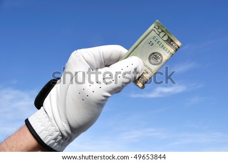 Golfer Wearing Golf Glove Holding a Twenty Dollar Bill
