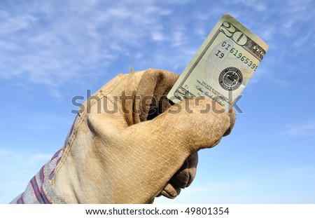 Worker Wearing Leather Work Glove Holding a Twenty Dollar Bill