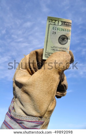Worker Wearing Leather Work Glove Holding a Twenty Dollar Bill