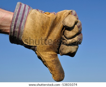 Worker Wearing Leather Work Glove Giving the Thumbs Down Sign
