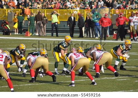 GREEN BAY, WI - NOVEMBER 22 : Green Bay Packers quarterback Aaron Rodgers prepares to take the snap in a game at Lambeau Field against the San Francisco 49ers on November 22, 2009 in Green Bay, WI