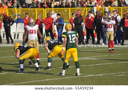 GREEN BAY, WI - NOVEMBER 22 : Green Bay Packers quarterback Aaron Rodgers prepares to take a shotgun snap in game at Lambeau Field against the San Francisco 49ers on November 22, 2009 in Green Bay, WI